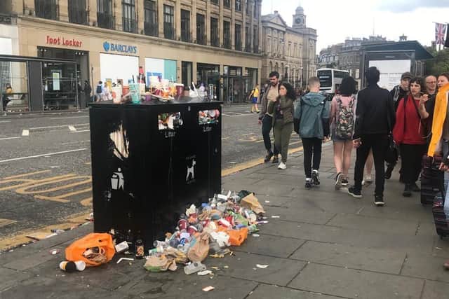 An overflowing bin in Princes Street - tourists are said to be taking photographs of Edinburgh's growing mounds of rubbish.