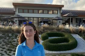 Grace Crawford stands in front of the Albany clubhouse during the final round of the Hero World Challenge on Sunday.