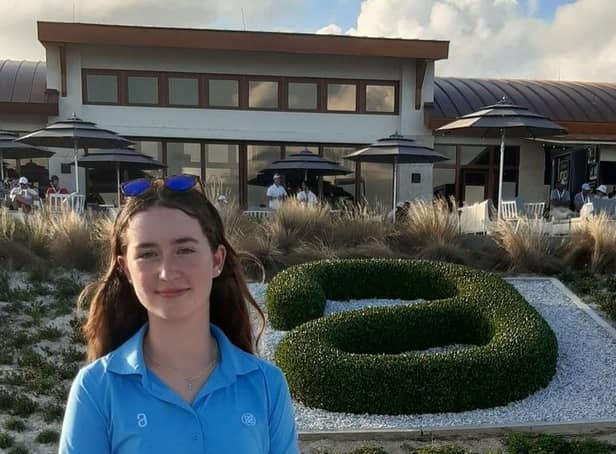 Grace Crawford stands in front of the Albany clubhouse during the final round of the Hero World Challenge on Sunday.