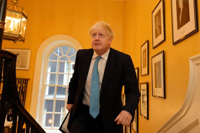 The Prime Minister Boris Johnson makes his way upstairs inside No10 Downing Street. Picture by Andrew Parsons / No 10 Downing Street