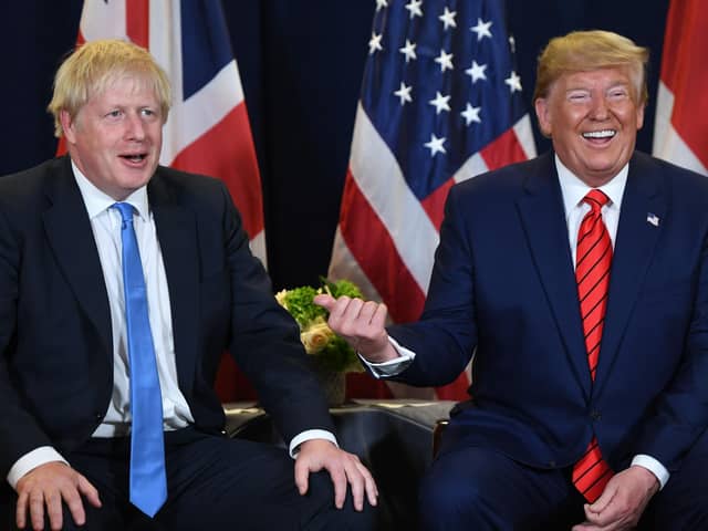 Boris Johnson, a bumbling officer class nincompoop, and Donald Trump,  a deranged conspiracy-theory-spouting bore, are otherwise respectively known as the UK Prime Minister and US President (Picture: Saul Loeb/AFP/Getty Images)