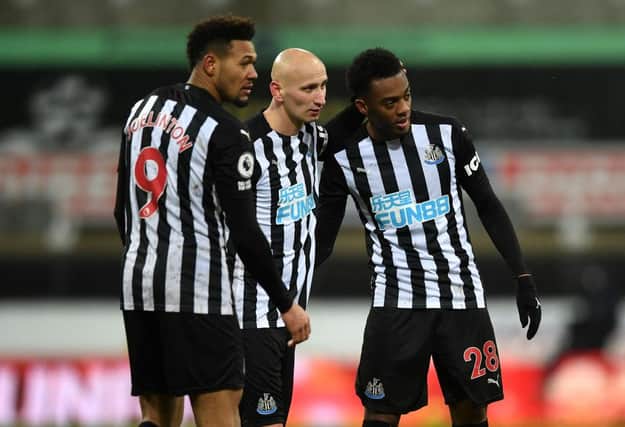 NEWCASTLE UPON TYNE, ENGLAND - FEBRUARY 06: Joe Willock of Newcastle United celebrates with team mates Joelinton and Jonjo Shelvey of after the Premier League match between Newcastle United and Southampton at St. James Park on February 06, 2021 in Newcastle upon Tyne, England.