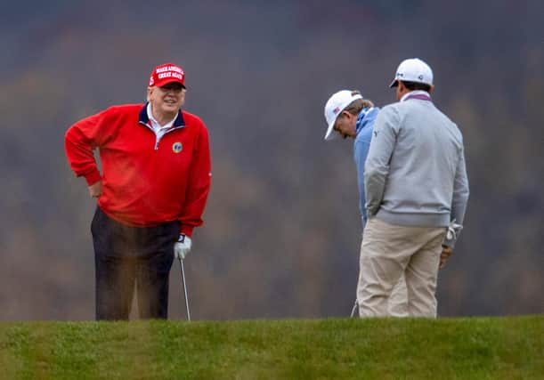 Donald Trump plays golf at the Trump National in Sterling, Virginia, on Friday (Picture: Tasos Katopodis/Getty Images)