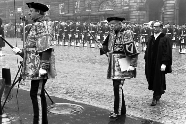 Sir James Monteith Grant, Lord Lyon King of Arms, makes his way to the Mercat Cross in Edinburgh, before proclaiming the dissolution of Parliament, April 1979.