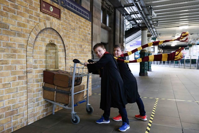 Twins Harris and Ethan Christie, both 9, pose with the Harry Potter Platform 9 ¾ trolley that was unveiled at Edinburgh Waverley train station. Following this, the trolley will tour stations across the UK and Ireland, to celebrate the 20th anniversary of Harry Potter and the Philosopher’s Stone release in UK cinemas. It will magically pop up in Birmingham, Cardiff, Belfast and Dublin.