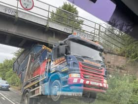 The skip lorry is stuck under the bridge, causing major delays.
Picture: Billy OFarrell