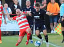 Bonnyrigg Rose goalscorer Lewis Turner challenges Falkirk's Steve Hetherington at New Dundas Park. Joe Gilhooley LRPS
