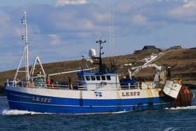 A man has died and seven crew members have been rescued after a Scottish trawler capsized off Norway.