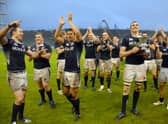 Captain Al Kellock holds the silverware as Scotland celebrate their Test series triumph over Argentina in 2010 after winning the second match in Mar del Plata. Picture: STR/AFP via Getty Images
