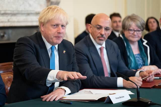 Boris Johnson and Nadhim Zahawi seen duing a Cabinet meeting last year (Picture: Stefan Rousseau/WPA pool/Getty Images)