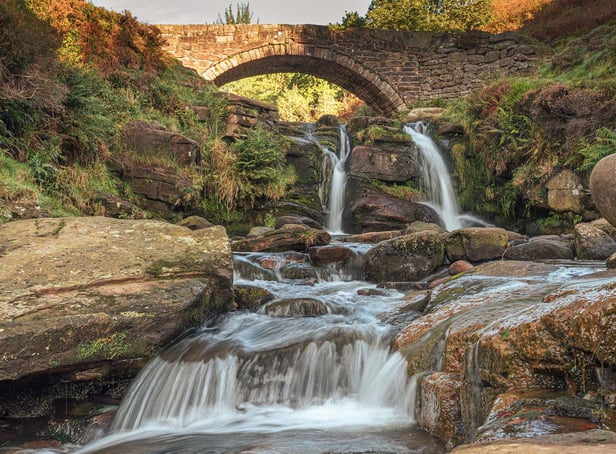 <p>Three Shires Head. A waterfall and packhorse stone bridge at Three Shires Head in the Peak District National Park.</p>