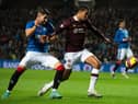 Hearts defender Toby Sibbick holds off Antonio Colak in a very solid performance at Ibrox Stadium. Picture: Mark Scates / SNS