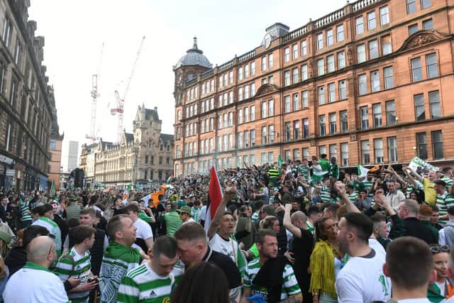 Celtic fans descended on the Merchant City and Glasgow Cross areas on Saturday to celebrate. Picture: Craig Foy/SNS Group