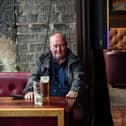 A customer sits with his beer in Jackson's Bar in the city centre of Glasgow on October 8, 2020. Photo by ANDY BUCHANAN/AFP via Getty Images