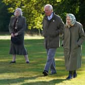Queen Elizabeth II and Prince of Wales at Balmoral Cricket Pavilion to mark the start of the official planting season for the Queen's Green Canopy (QGC) at the Balmoral Estate. Picture date: Friday October 1, 2021.