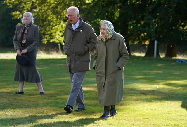 Queen Elizabeth II and Prince of Wales at Balmoral Cricket Pavilion to mark the start of the official planting season for the Queen's Green Canopy (QGC) at the Balmoral Estate. Picture date: Friday October 1, 2021.