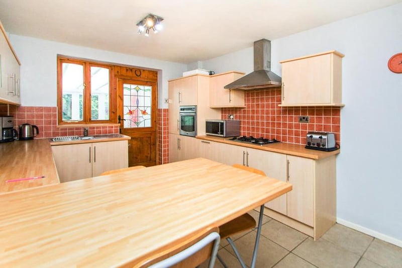 The breakfast kitchen has an internal door and window, with a range of wall, drawer and base units. Not to mention a built-in oven, gas hob with extractor over, integrated fridge and and breakfast bar.