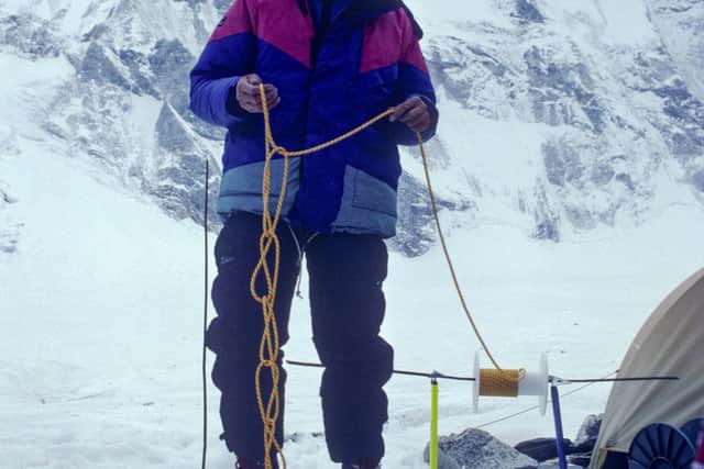 Stephen Venables at Advance Base Camp, preparing another 100 length of rope for fixing on the route above.