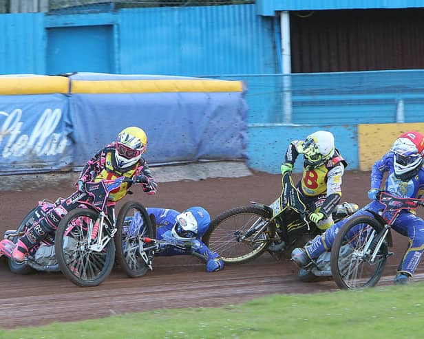 Monarchs guest Greg Blair slides off his bike in heat two while Jacob Hook, red helmet, goes up the inside. Picture: Jack Cupido.
