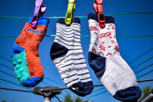 Odd socks are traditionally used to participate in World Down Syndrome Day. Photo: Warren Bourne / Getty Images / Canva Pro.