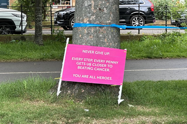 Signs along the route reminded readers of why they were taking part and one of the event's hosts announced that more than £116,000 had been raised for Cancer Research UK.
