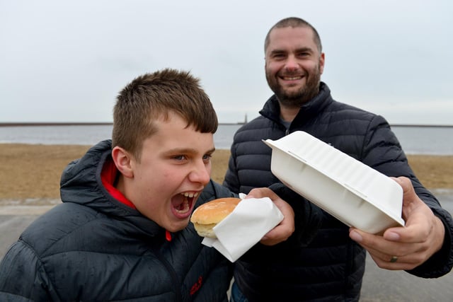 Liam Owen from Roker, tucks into his lunch with his dad David.