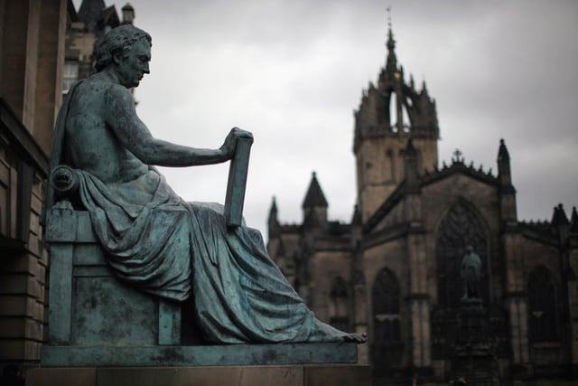 The statue of philosopher David Hume on Edinburgh's Royal Mile with St Giles looming in the background. Breathtaking.