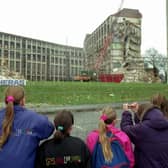 Children watching the old Westburn blocks of flats being demolished at Wester Hailes, Edinburgh. Picture taken January 1993.