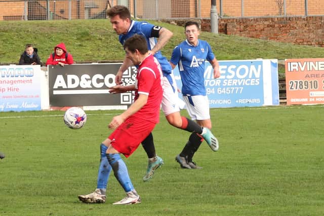 Penicuik Athletic (in red) went out of the South Challenge Cup at Irvine Meadow