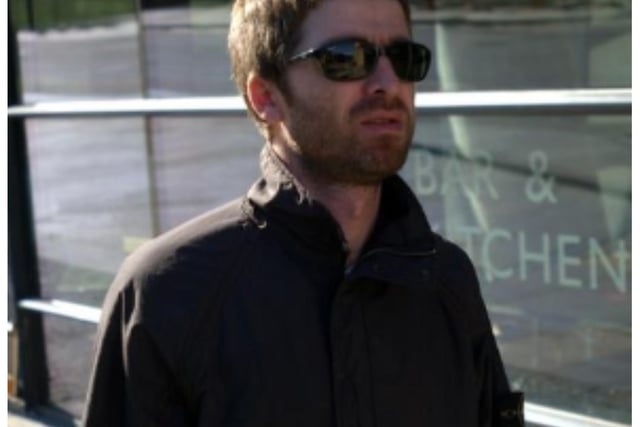 Noel Gallagher of Oasis having a walk down Holyrood Road in Edinburgh before the band's gig at The Corn Exchange in September 2002.
