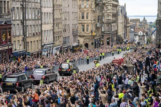 The hearse carrying the coffin of Queen Elizabeth II passes down the Royal Mile in Edinburgh (PA)