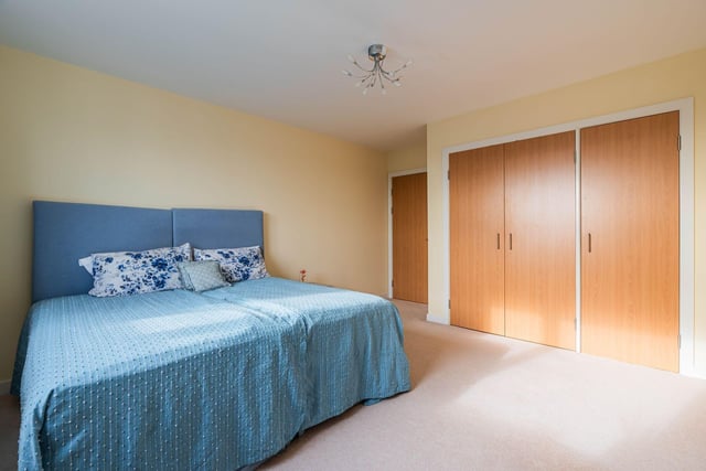 The Newhaven property's second generously-proportioned double bedroom also comes with integrated wardrobes and more stunning views of the city skyline.