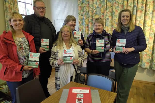 Rosewell Community Council Committee and Volunteers at teh book fayre with the free books given out to visitors.