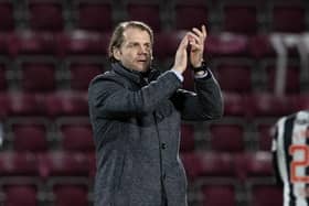 Robbie Neilson applauds Hearts fans after the Scottish Cup win against St Mirren.