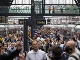 Scotland fans arrive at King's Cross Station on Thursday ahead of the England match.