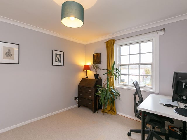 One of the bedrooms is currently used as a study.