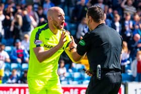 Hibs captain David Gray remonstrates with referee Andrew Dallas during a match in May 2019