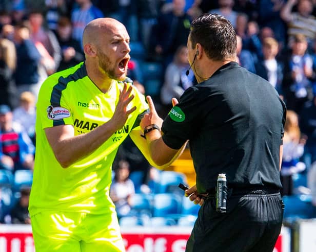 Hibs captain David Gray remonstrates with referee Andrew Dallas during a match in May 2019