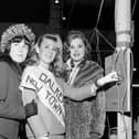 Dalkeith's New Town Girl, 18-year-old Joan Hepburn, switches on the Christmas Lights alongside runners-up Ruth Wysick and Teresa O'Brien in 1964.