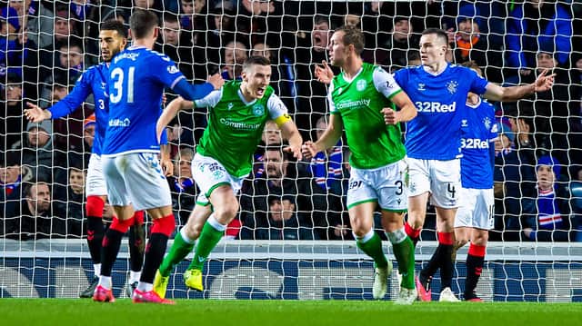 Paul Hanlon wheels away after netting at Ibrox in February