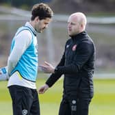 Steven Naismith and Peter Haring deep in discussion at Hearts training on Thursday.