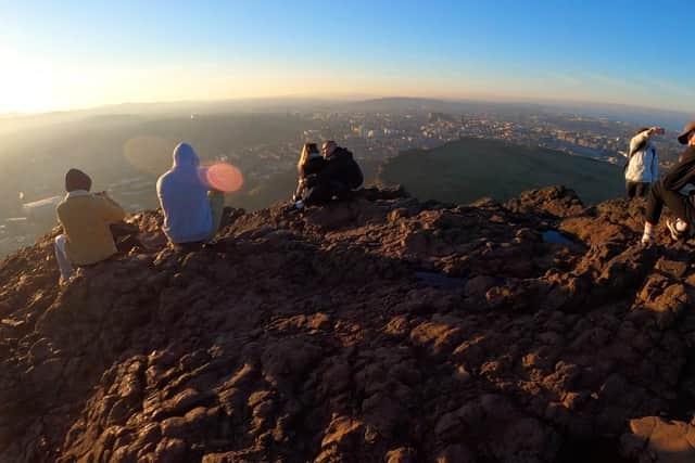 Hikers take in the view across Edinburgh from Arthur's Seat. Picture: Ruairidh Mason