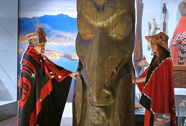 Sim’oogit Ni’isjoohl (Chief Earl Stephens) and Noxs Ts’aawit (Dr Amy Parent) stand with the House of Ni'isjoohl Memorial Pole in the National Museum of Scotland in August (Picture: Neil Hanna)