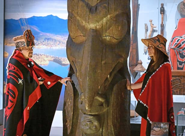 Sim’oogit Ni’isjoohl (Chief Earl Stephens) and Noxs Ts’aawit (Dr Amy Parent) stand with the House of Ni'isjoohl Memorial Pole in the National Museum of Scotland in August (Picture: Neil Hanna)