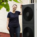 Claire Miller with a heat pump