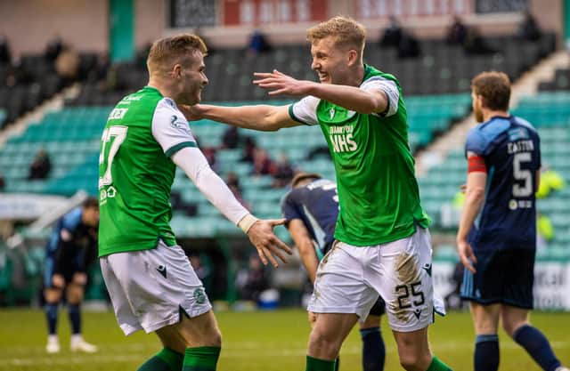 All smiles from Hibs' wingbacks as Chris Cadden congratulates Josh Doig on his first senior goal in green and white