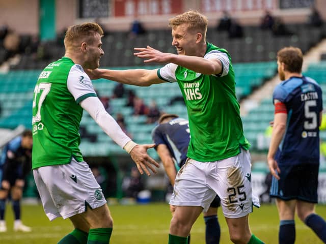 All smiles from Hibs' wingbacks as Chris Cadden congratulates Josh Doig on his first senior goal in green and white