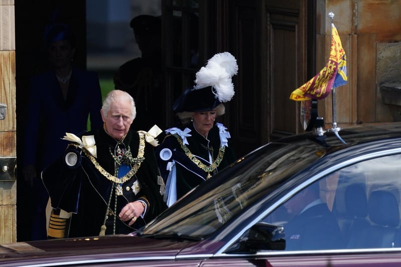 King Charles III and Queen Camilla leave the Palace of Holyroodhouse to be driven to the National Service of Thanksgiving and Dedication at St Giles' Cathedral