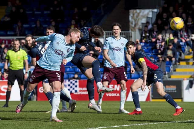 Hearts defender Stephen Kingsley goes close with a header against Ross County