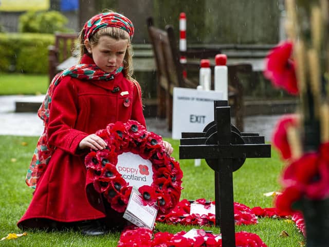 10year old Amelia Armstrong lays Poppy Scotland wreath